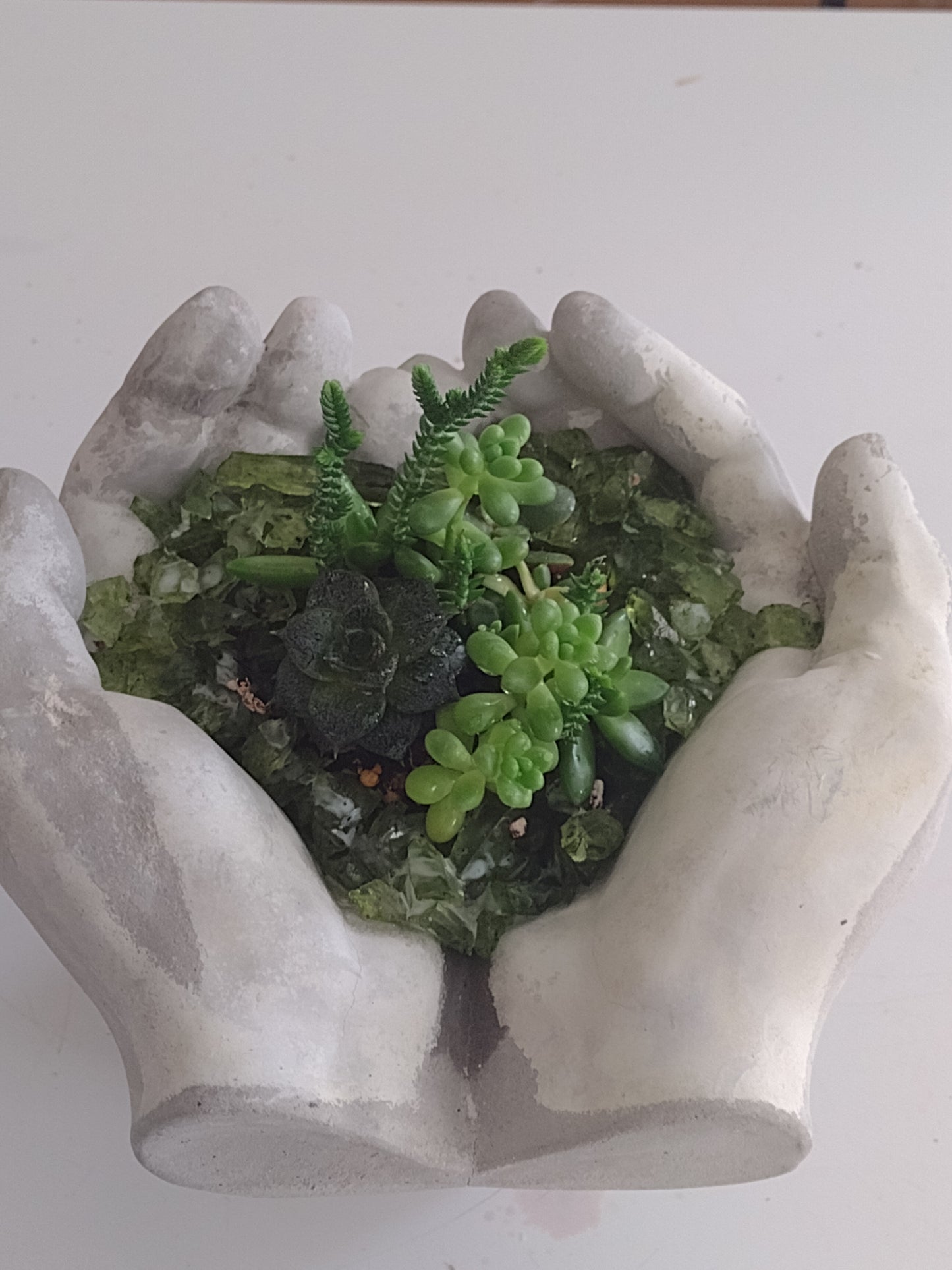 Cement hand planter (plants not included)
